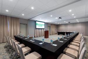 a long table in a room with chairs and a screen at Wyndham Garden Miami International Airport in Miami +49 photos