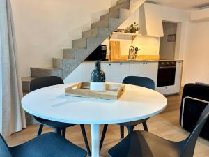 a table with a bottle on it in a kitchen at Verblijf in het Pajottenland in Gooik