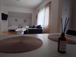 a living room with a table with two plates on it at Vista in Vaasa