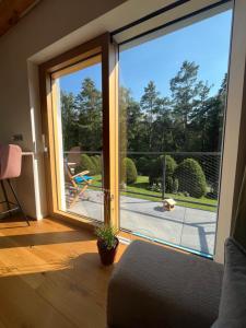 a sliding glass door with a view of a patio at chata Jarka in Jivno