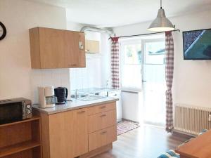 a kitchen with a sink and a counter top at Dürnberger in St Martin in Scheffsnoth