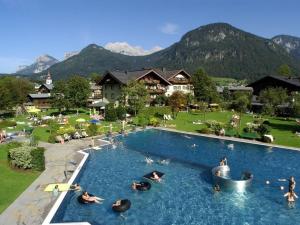 a large swimming pool with people in the water at Dürnberger in St Martin in Scheffsnoth