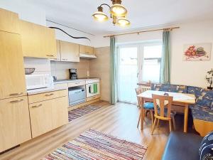 a kitchen with a table and a dining room at Dürnberger in St Martin in Scheffsnoth