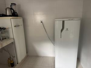 a kitchen with two refrigerators in a room at Ebeneze in Nova Friburgo