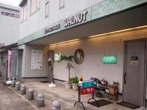 a store with a sign on the side of a building at ゲストハウスノーチェ in Shingū +32 photos