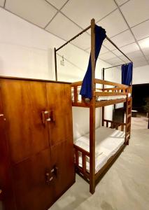 a couple of bunk beds in a room at Wave Hostels Arugam Bay - With Swimming Pool in Arugam Bay +6 photos