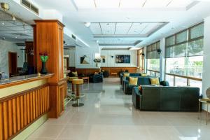 a waiting area in a hospital with couches at Hotel Trezor in Varna City +65 photos