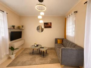 a living room with a couch and a table at Victory homes in Eldoret