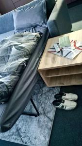 a bed and a coffee table with a bed and a coffee table sidx sidx sidx at Nice Apartment mit Balkon in Glauburg in Glauburg