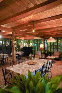 a large patio with a large table and chairs at Hotel & Wine Cellar ARGE in Telavi