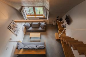 an overhead view of a loft with a couch and a table at HOT_elarnia Hotel & Spa in Puszczykowo +73 photos