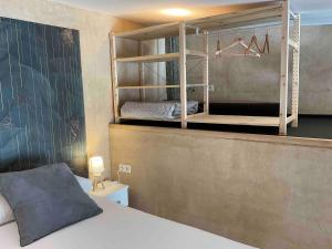a bedroom with a bunk bed and a mirror at Can Padrosa Mini Loft 2 in Riumors +36 photos