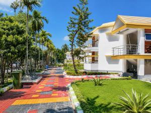 a walkway in front of a building at Jowar Hotel & Resort in Digha
