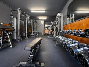 a gym with rows of treadmills and machines at Hotel Rec de Palau in Cadaqués +24 photos