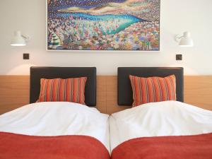 Кровать или кровати в номере Fuglsangcentret Hotel