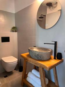 a bathroom with a sink and a toilet at Ovio II in Kampos Paros +7 photos