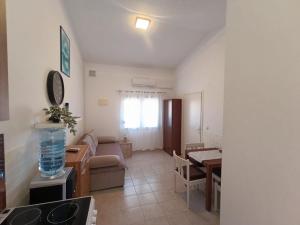 a living room with a couch and a table at Apartman Mivela in Vir