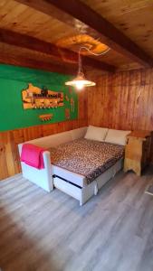 a bedroom with a bed in a wooden room at Srub v lese in Hrabŭvka +40 photos