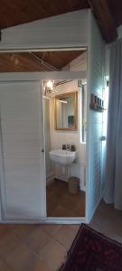 a bathroom with a toilet and a sink in it at Giardino Antico in Montecarotto