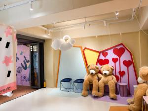 two teddy bears sitting on the floor in a room at Hotelarrive Seoulful in Seoul +10 photos