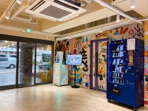 a store with a soda machine in a room at Hotelarrive Seoulful in Seoul