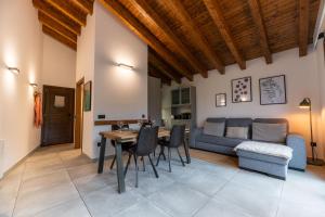 a living room with a table and a couch at Can Pont in Camprodon