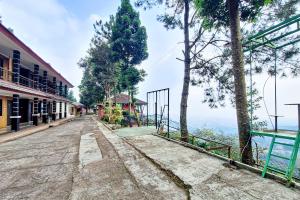an empty street with a view of the ocean at Urbanview Hotel Salakview Megamendung in Pondok Cipaseban