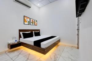 a bedroom with a bed in a room at Hotel O JIND RESORT in Jīnd