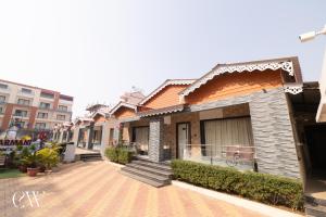 a row of houses on a street at Rath Inns Beach Resort Mandarmani in Mandarmoni