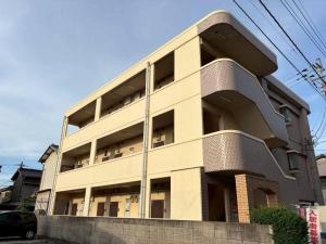 a largeartment building with at アルゴ境川 in Kitakyushu