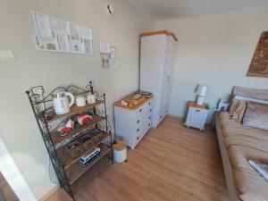 a bedroom with a bed and a dresser at Muddy Puddles Farm in Kovachevets