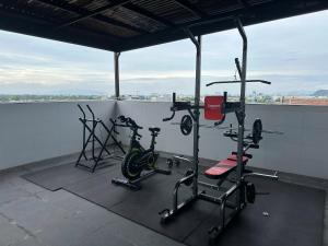 a gym with two exercise bikes on a roof at Savia Home in Danang