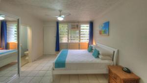 a bedroom with a bed and a glass door at Loyang Apartment 1 in Arcadia