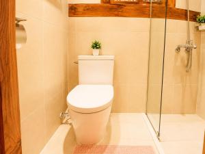 a bathroom with a toilet and a shower at HAEMIL Hanok 해밀한옥 in Seoul