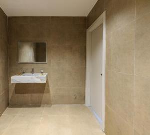 a bathroom with a sink and a shower at Abeille Rooms in Himare +4 photos