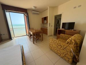 a living room with a view of the ocean at Residenza La Signora vista mare con ascensore in Marotta