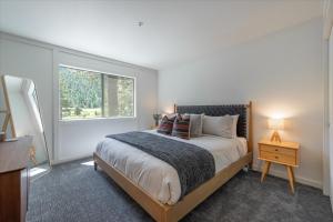a bedroom with a large bed and a window at Alpenglow Loft condo in Olympic Valley
