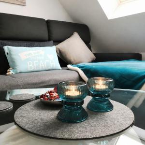 a living room with a coffee table and a couch at Sonnendeck 36 - Großenbrode in Grossenbrode