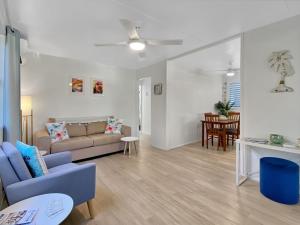 a living room with a couch and a table at Magnetic Haven Unit 5 in Arcadia