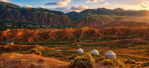 a view of a mountain range with three domes at Kyzyl-Jar in Kaji-Say
