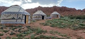 a group of three domes in the desert at Kyzyl-Jar in Kaji-Say