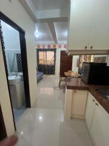 a kitchen with a sink and a counter top at DC Travellers Inn Unit E 3rd Fl in Malolos +11 photos