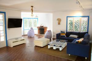 a living room with a couch and a table at Superb Seafront Villa in Cambrils