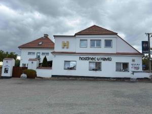 a white building with arosis uklaw written on it at Hostinec U Havlů in Olomouc