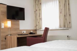 TV a/nebo společenská místnost v ubytování Hotel Schützenburg