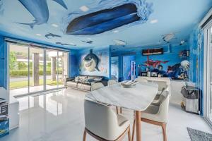 a dining room with a blue ceiling and a table and chairs at Shark House - Pool Villa RB13 in Ban Klam