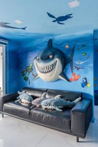 a mural of a shark in the ocean at Shark House - Pool Villa RB13 in Ban Klam