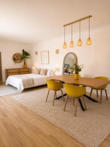 a bedroom with a bed and a table and chairs at Casa Concha - Peaceful and Relaxing in Lagos +33 photos