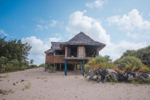 a small house on the beach with aermott at Kizingo Beach Eco Lodge in Lamu