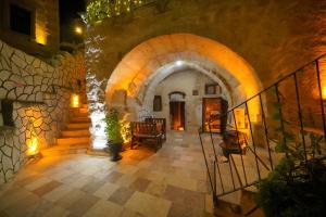 a hallway with an archway in a building at Coco Cave in Göreme